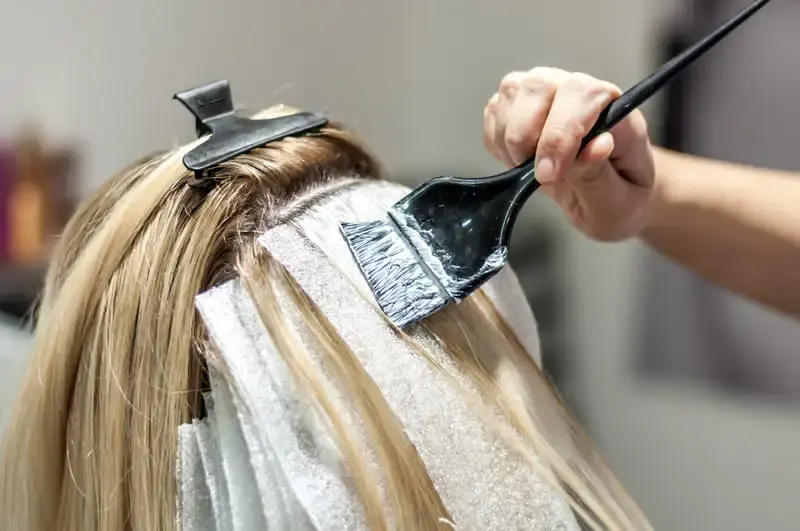 Hair before and after root color retouch.